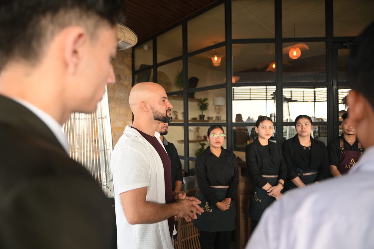 Rish Saini briefing the Ālaya floor team on the terrace before service