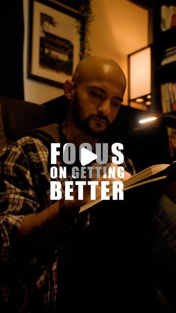 Rish Saini reading a book in a dim room, with the words focus on getting better